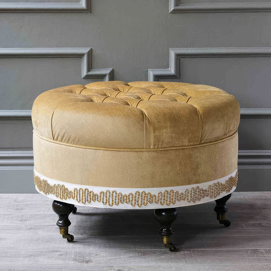 Pouf rond en velours capitonné