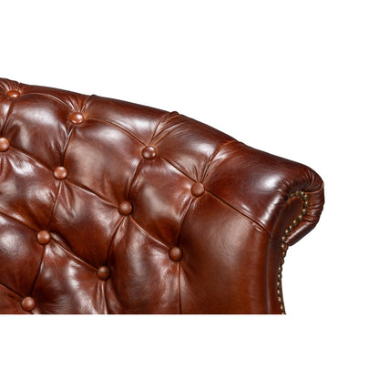 Chaise à dossier tonneau en cuir marron