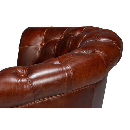 Chaise à dossier tonneau en cuir marron