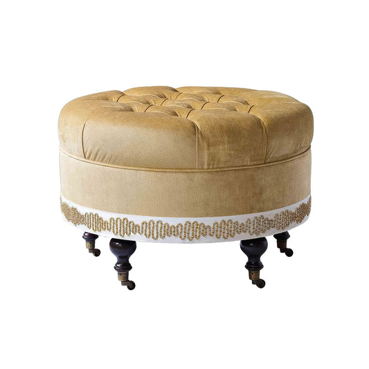 Pouf rond en velours capitonné